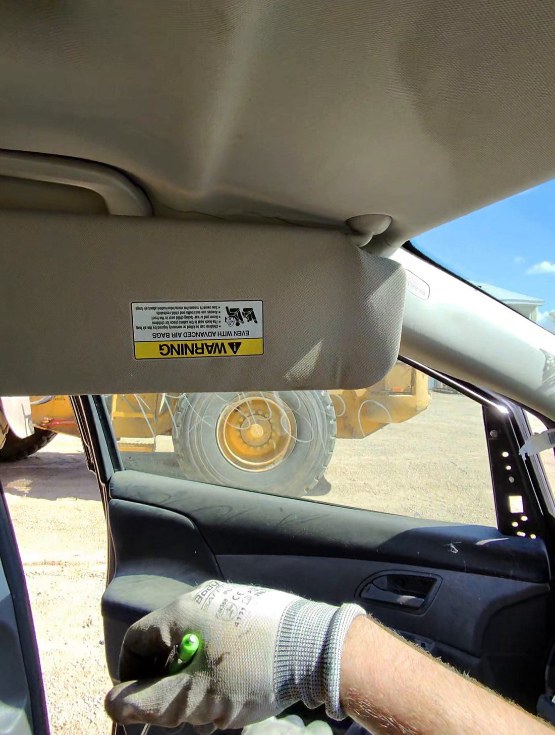 Honda Odyssey sun visor shown lowered before removal